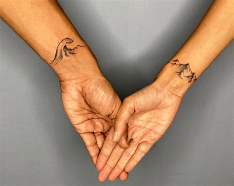 matching black couple tattoos|unique couple connecting tattoos.